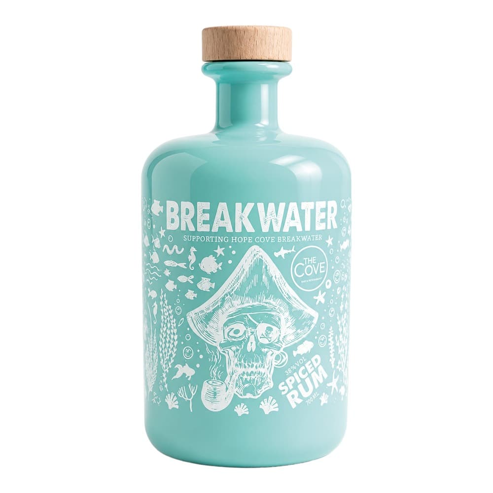 A turquoise-coloured glass bottle of Breakwater spiced rum with a natural wooden cork top, featuring white illustrated artwork of a pirate skull and ocean-themed design on the label.