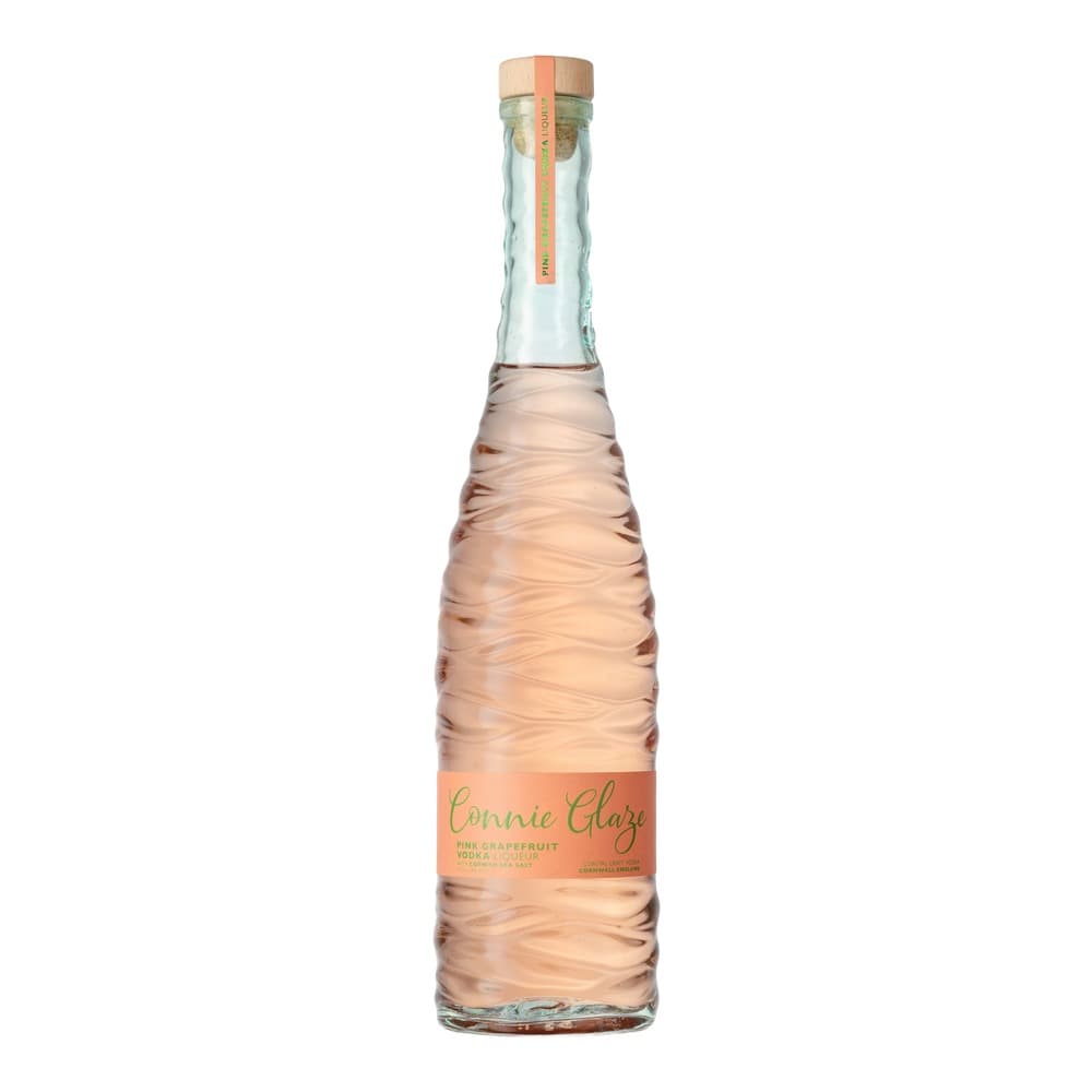 A bottle of Connie Glaze pink grapefruit vodka liqueur with a wooden cork top and orange label, displayed against a white background.