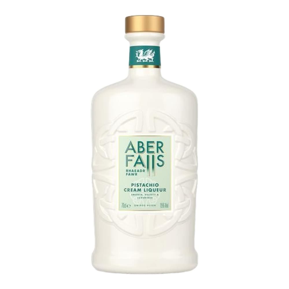 A bottle of Aber Falls Pistachio Cream Liqueur with a cream-coloured label featuring a Welsh dragon, gold cap, and green band against a white background.