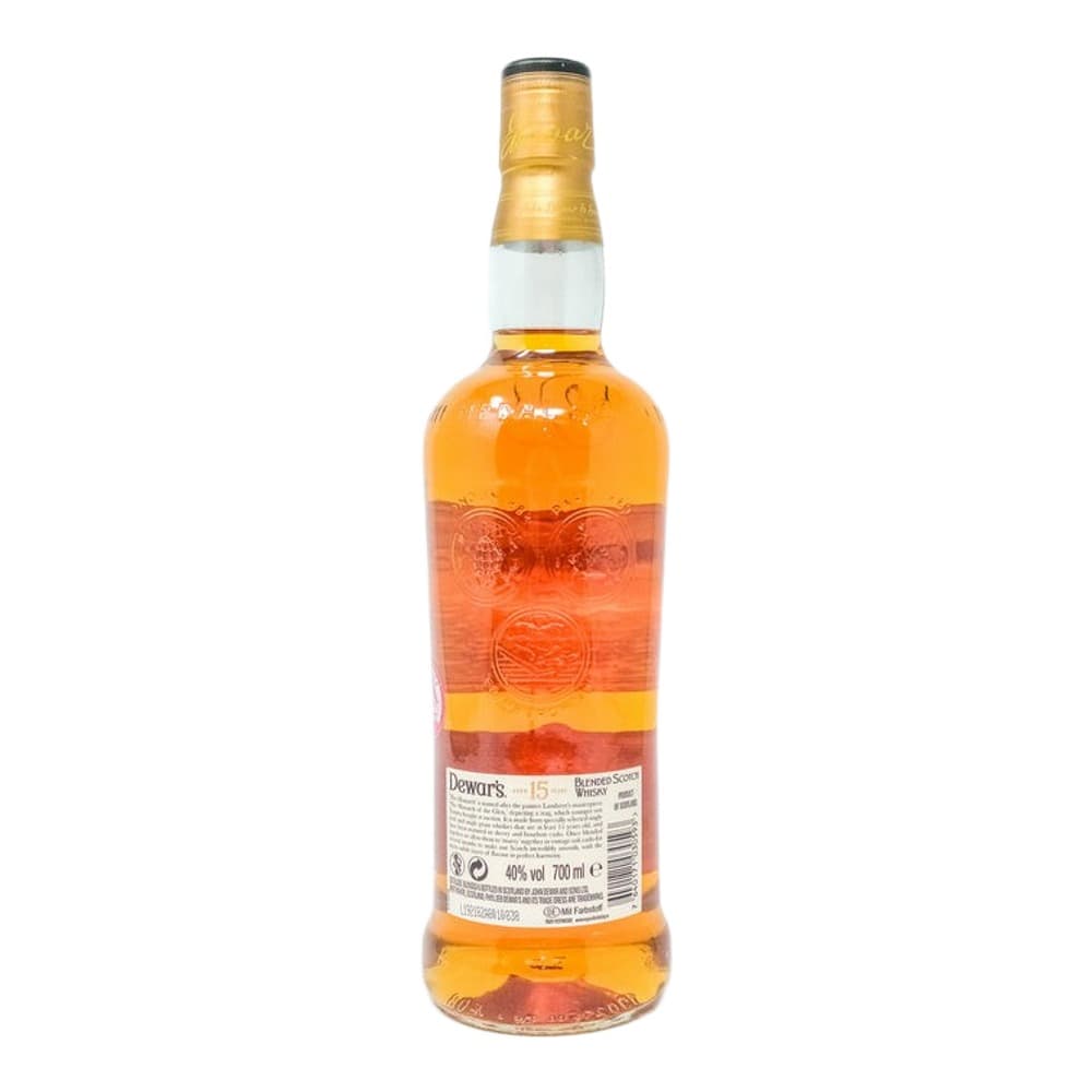A bottle of Dewar's 15 year old blended Scotch whisky with a gold foil cap and label, photographed against a white background.
