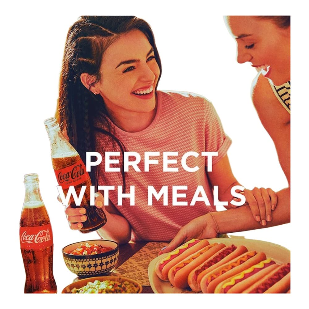 Vintage advertisement showing a smiling woman in a red shirt enjoying Coca-Cola bottles with hot dogs and other food items at a dining table