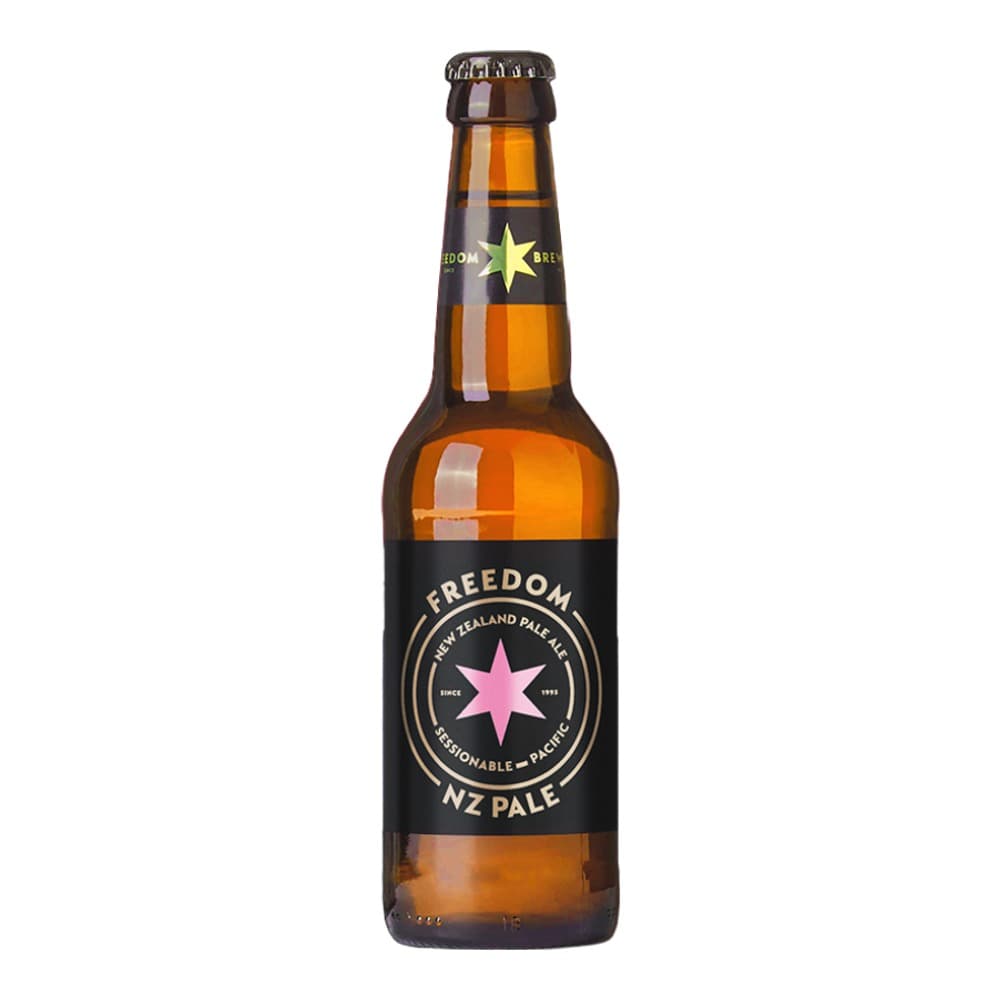 A 330ml bottle of Freedom Brewing New Zealand Pale Ale with a pink star logo on the black label, set against a Union Jack background