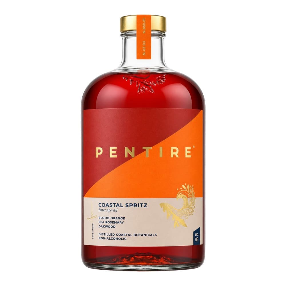 A bottle of Pentire Coastal Spritz, a non-alcoholic bitter aperitif with a red and orange label featuring blood orange, sea rosemary and oakwood botanicals, displayed against a white background.