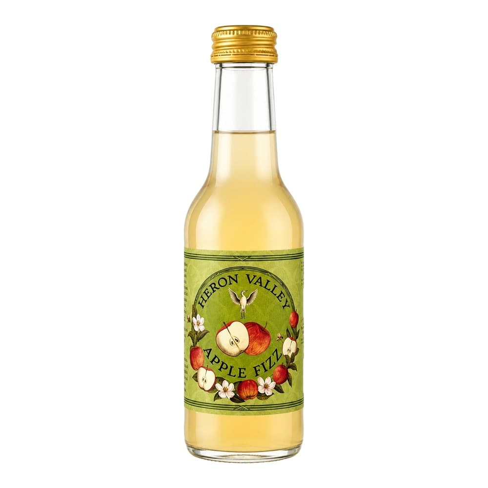 A glass bottle of Heron Valley Apple Fizz with a golden screw cap, filled with pale yellow sparkling cider, displayed against a white background.