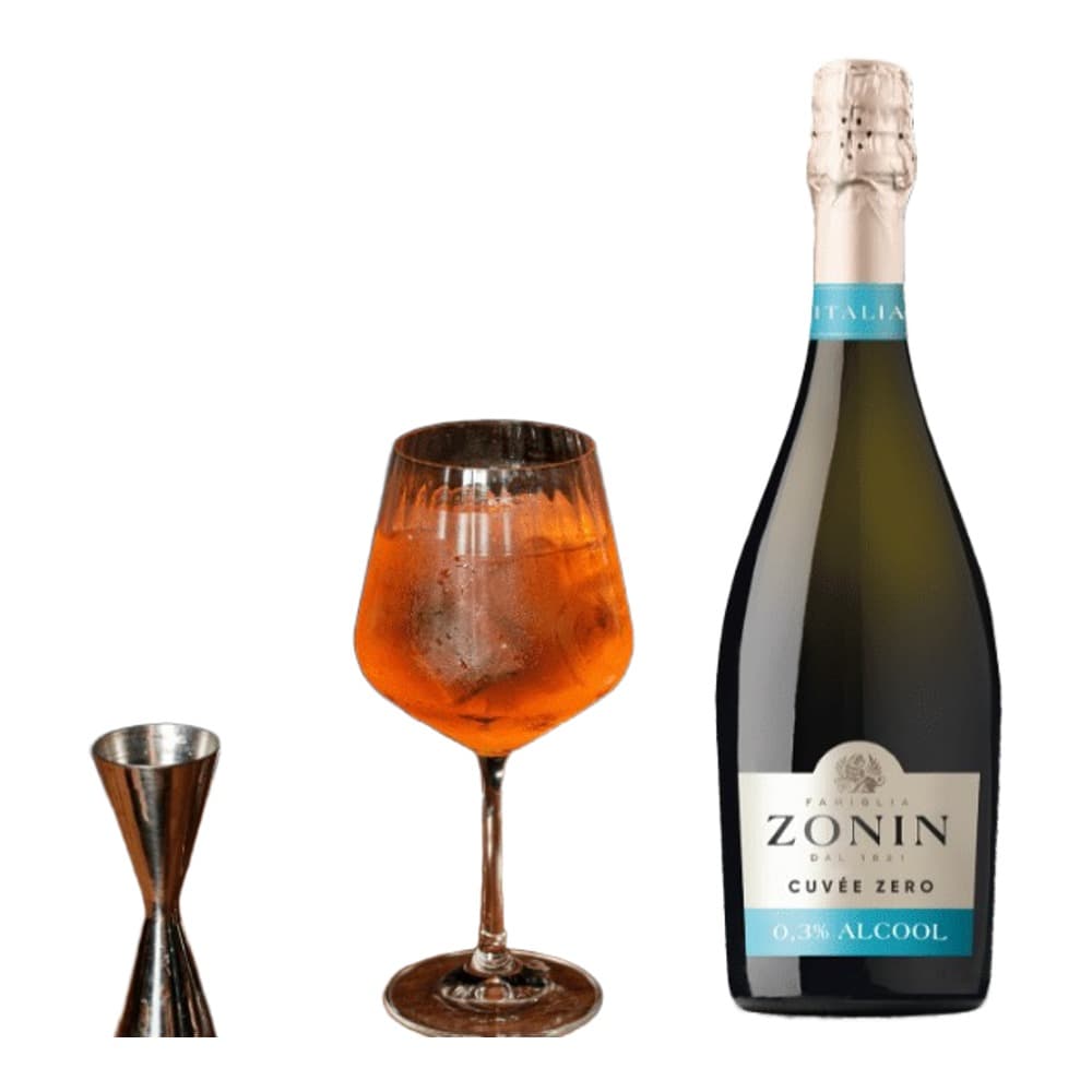 A bottle of Zonin Cuvée Zero 0.0% alcohol sparkling wine displayed next to a lifestyle scene showing a bartender's hand pouring a vibrant orange cocktail into a wine glass on a wooden bar counter.