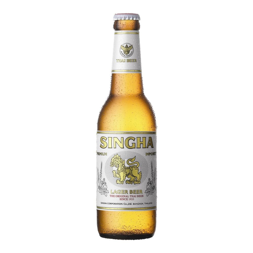 A chilled bottle of Singha Premium Lager Beer with condensation on the glass, featuring a white label with gold lettering and a Thai lion emblem, photographed against a white background.