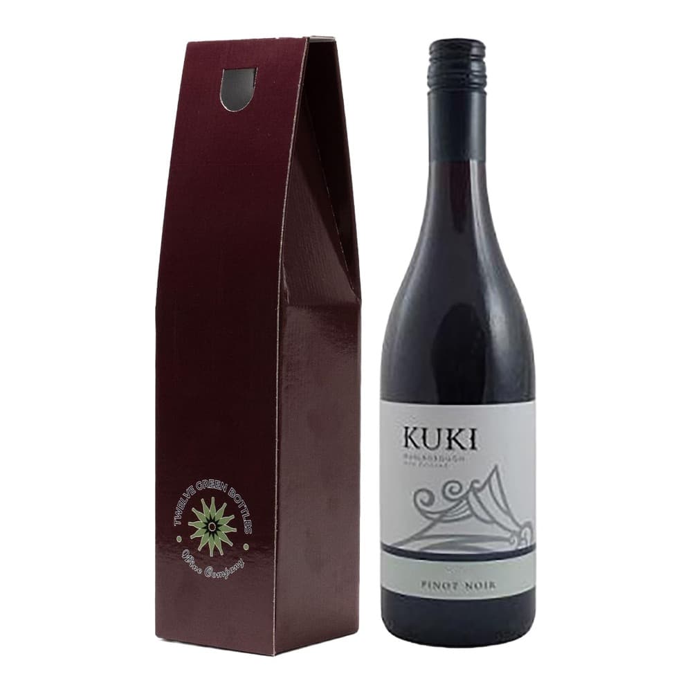 A bottle of Kuki Pinot Noir wine positioned next to its burgundy gift box with a decorative sun logo on a white background.