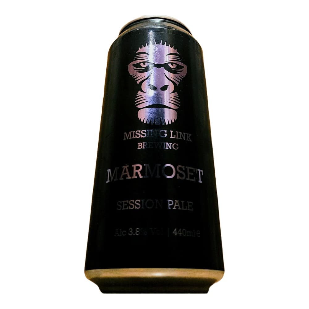 Black beer can with purple primate illustration for Missing Link Brewing Marmoset Session Pale Ale, 440ml, 3.8% ABV, photographed against wooden background