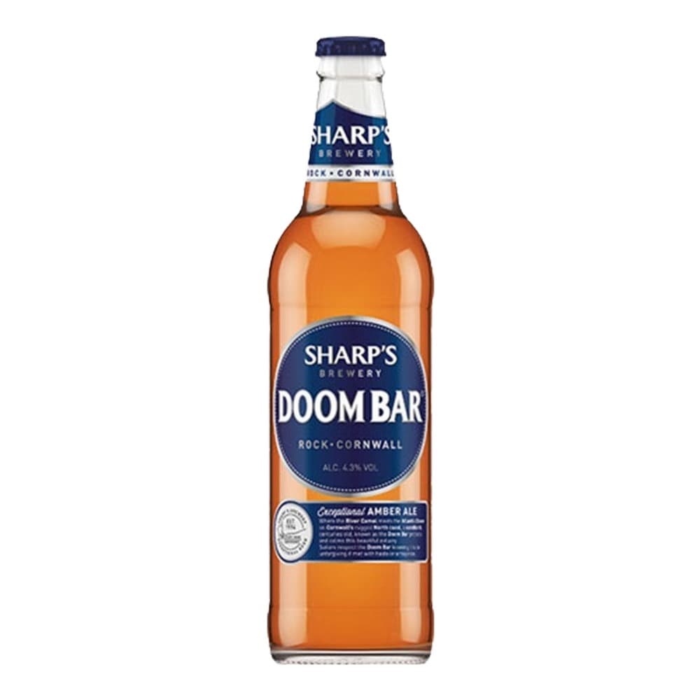 A bottle of Sharp's Doombar Amber Ale from Rock, Cornwall, featuring an amber-coloured beer with a dark blue label on a white background.