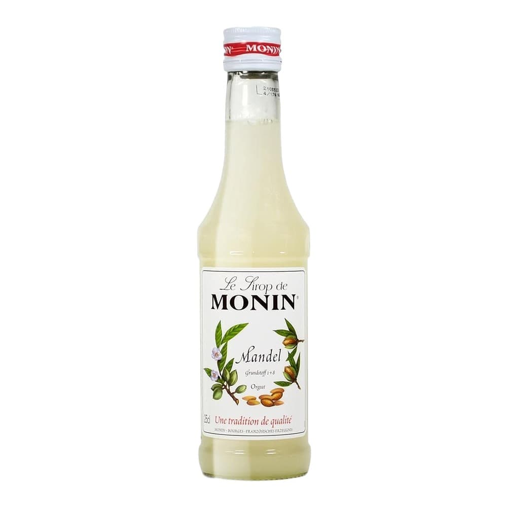 A bottle of Monin Mandel almond-flavoured syrup with a cream-coloured liquid, displayed against a white background with a reflection beneath.
