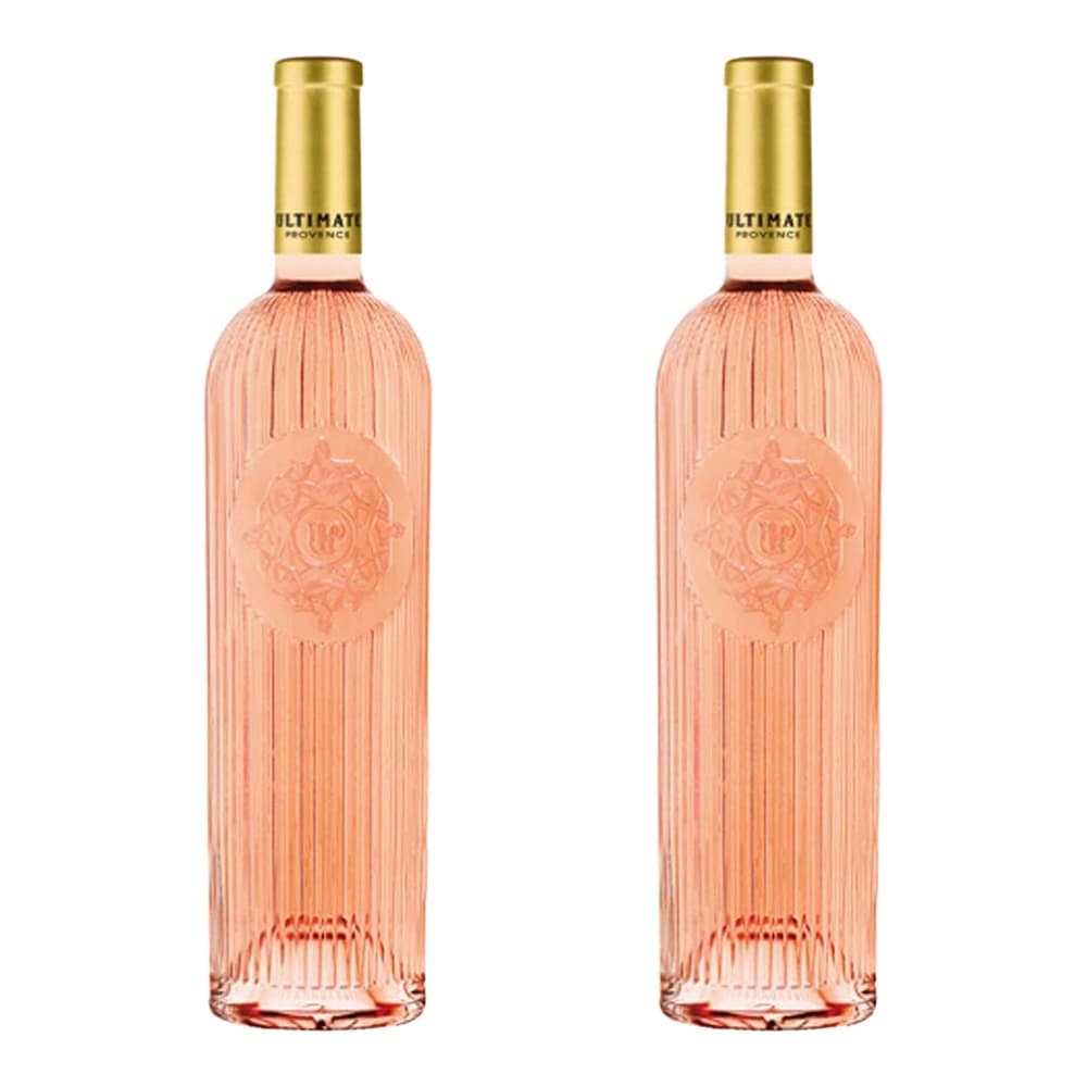 Two bottles of Ultimate Provence rosé wine with gold caps and textured glass bottles on a white background