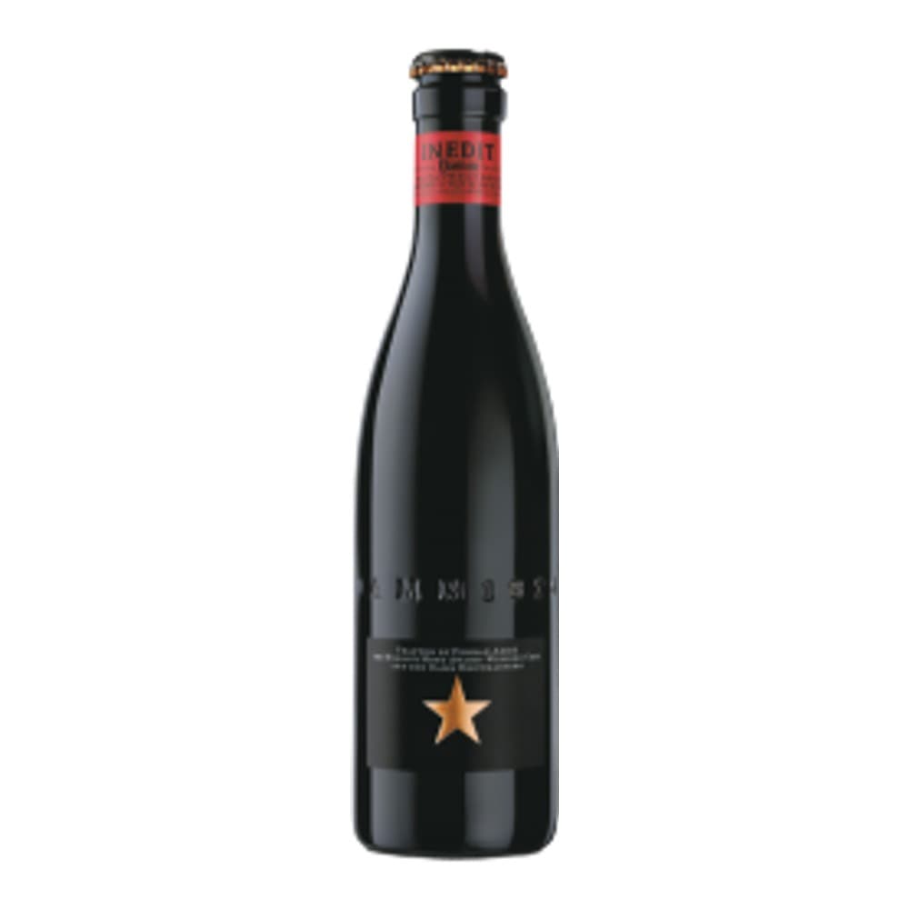 A dark glass wine bottle with a red foil capsule and gold star logo on a white background