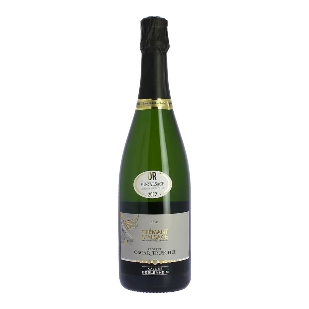 A bottle of Oscar Truschel Crémant d'Alsace Brut sparkling wine from 2022, featuring a gold label and black foil capsule, photographed against a white background.