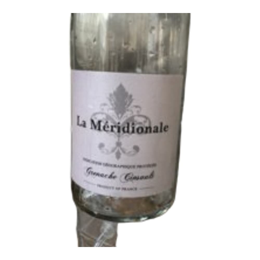A bottle of La Méridionale rosé wine with pale pink label against a blurred background.