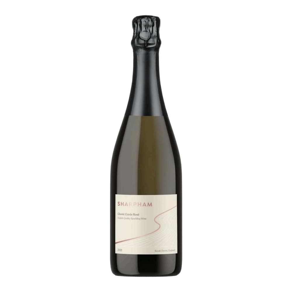 A bottle of Sharpham Classic Cuvée Rosé sparkling wine with a cream-coloured label and foil-wrapped cork top, photographed against a white background.