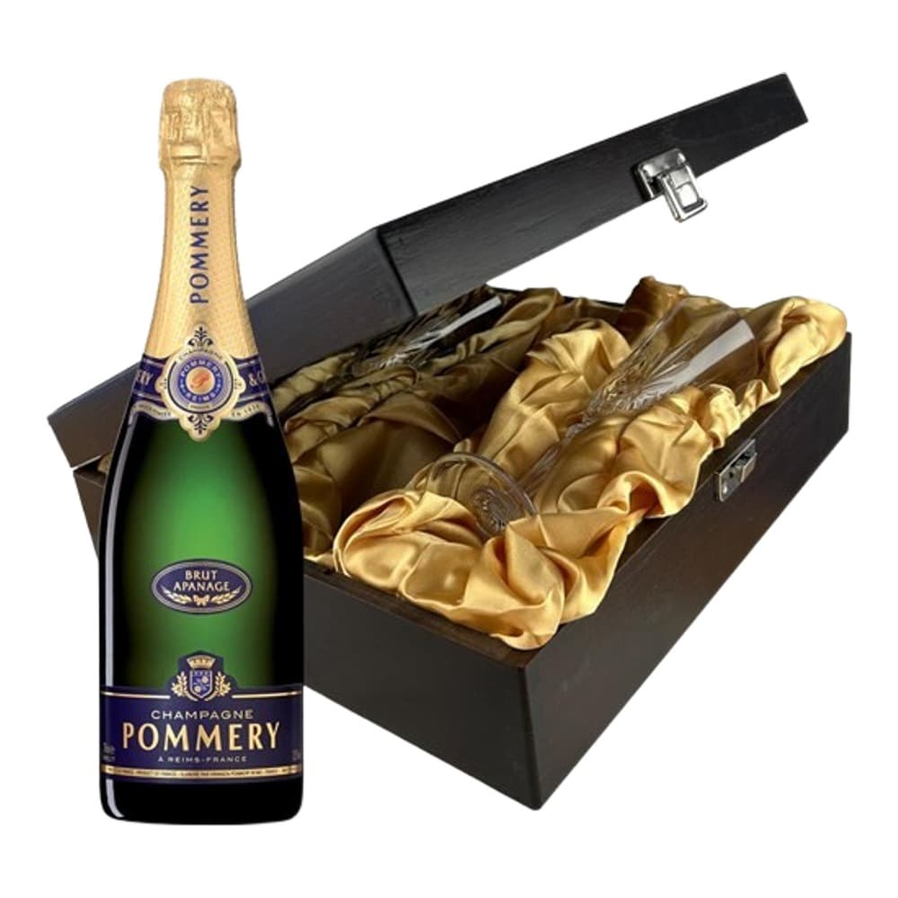 A bottle of Pommery champagne positioned next to an open black luxury gift box lined with gold fabric