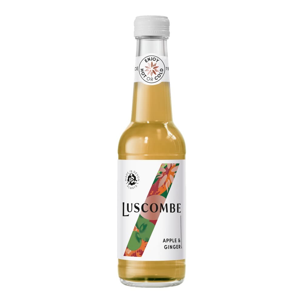 A clear glass bottle of Luscombe Apple & Ginger drink with a white cap, displayed against a plain white background. The label features a colourful diagonal stripe design with autumn foliage colours.