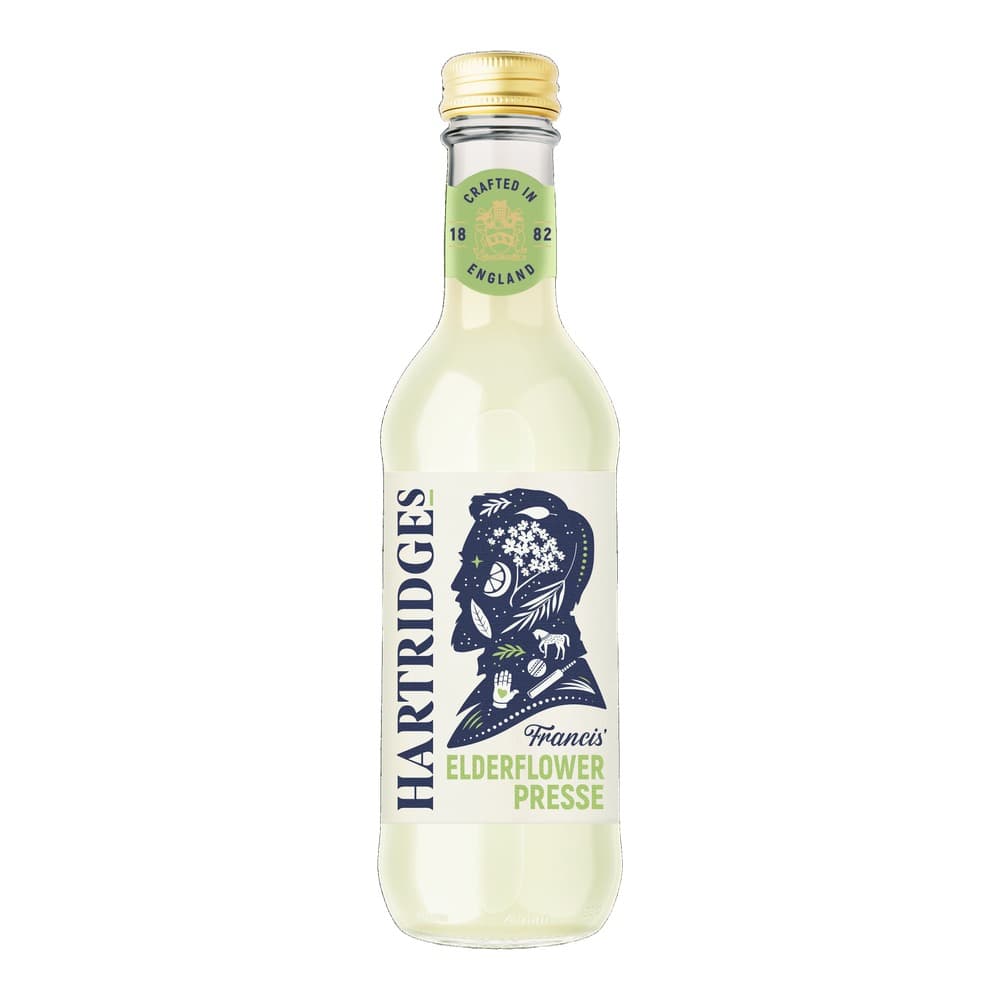 A glass bottle of Hartridges Francis Elderflower Presse with pale yellow liquid, gold cap, green circular label showing 'Crafted in 1882 England', and navy blue silhouette design on white label.