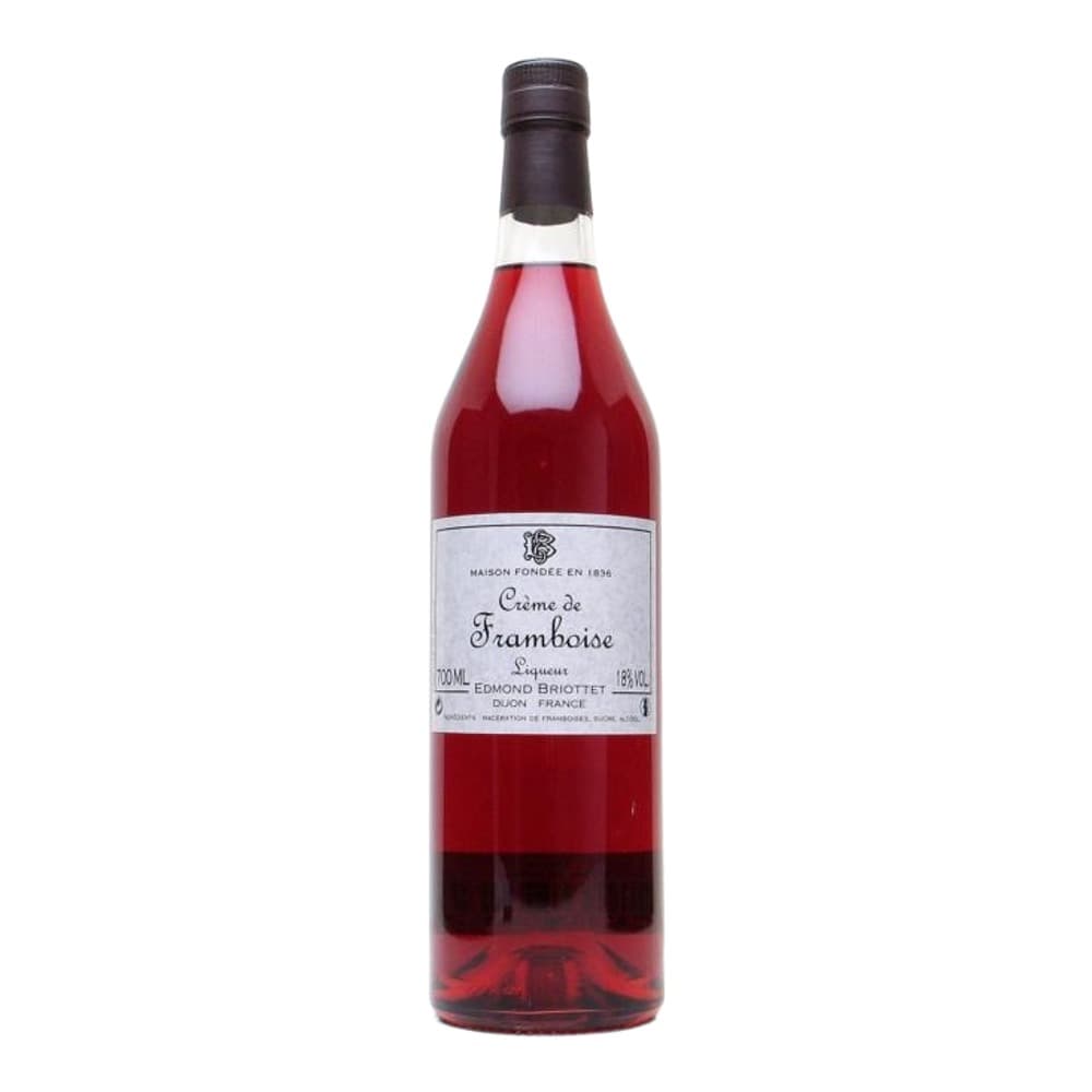 A bottle of Crème de Framboise raspberry liqueur by Edmond Briottet against a white background.
