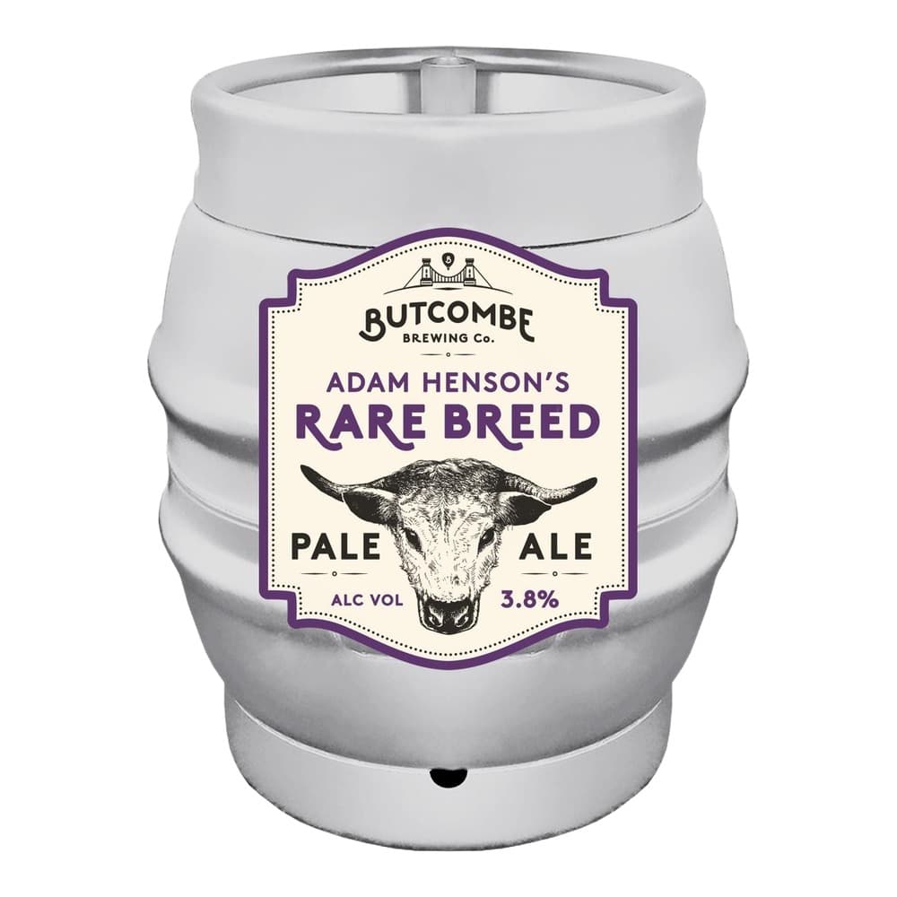 White metal beer keg with purple and cream label featuring Butcombe Brewing Co. branding and an illustration of a bull's head, labelled as Adam Henson's Rare Breed Pale Ale 3.8% ABV.
