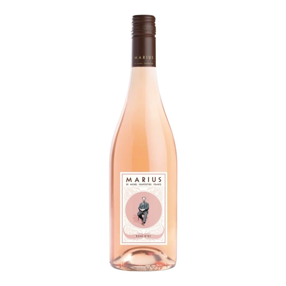 A bottle of Marius Rosé d'Oc wine by Michel Chapoutier from France, displayed against a white background with a pale pink label featuring a portrait illustration.