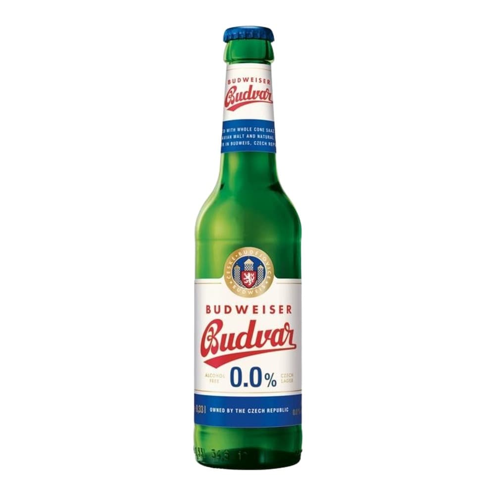 A green glass bottle of Budweiser Budvar 0.0% alcohol-free beer with a blue cap, white label, and gold medallion logo, photographed against a white background.