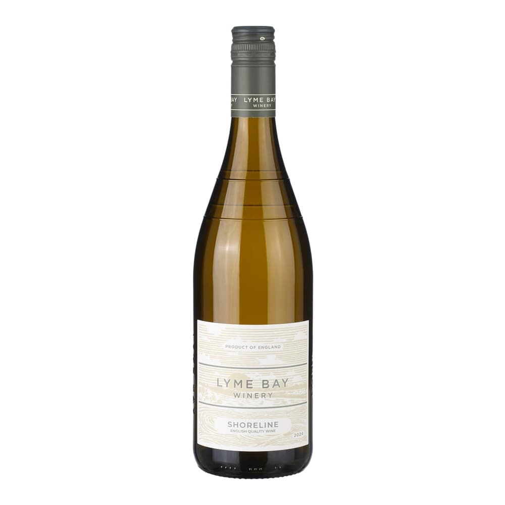 A bottle of Lyme Bay Winery Shoreline white wine from England, displayed against a plain white background with a dark screw cap and cream-coloured label.