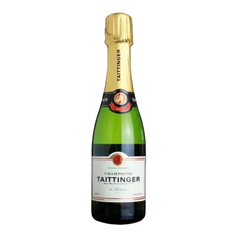 A bottle of Taittinger Champagne with a gold foil cap and green glass against a white background.