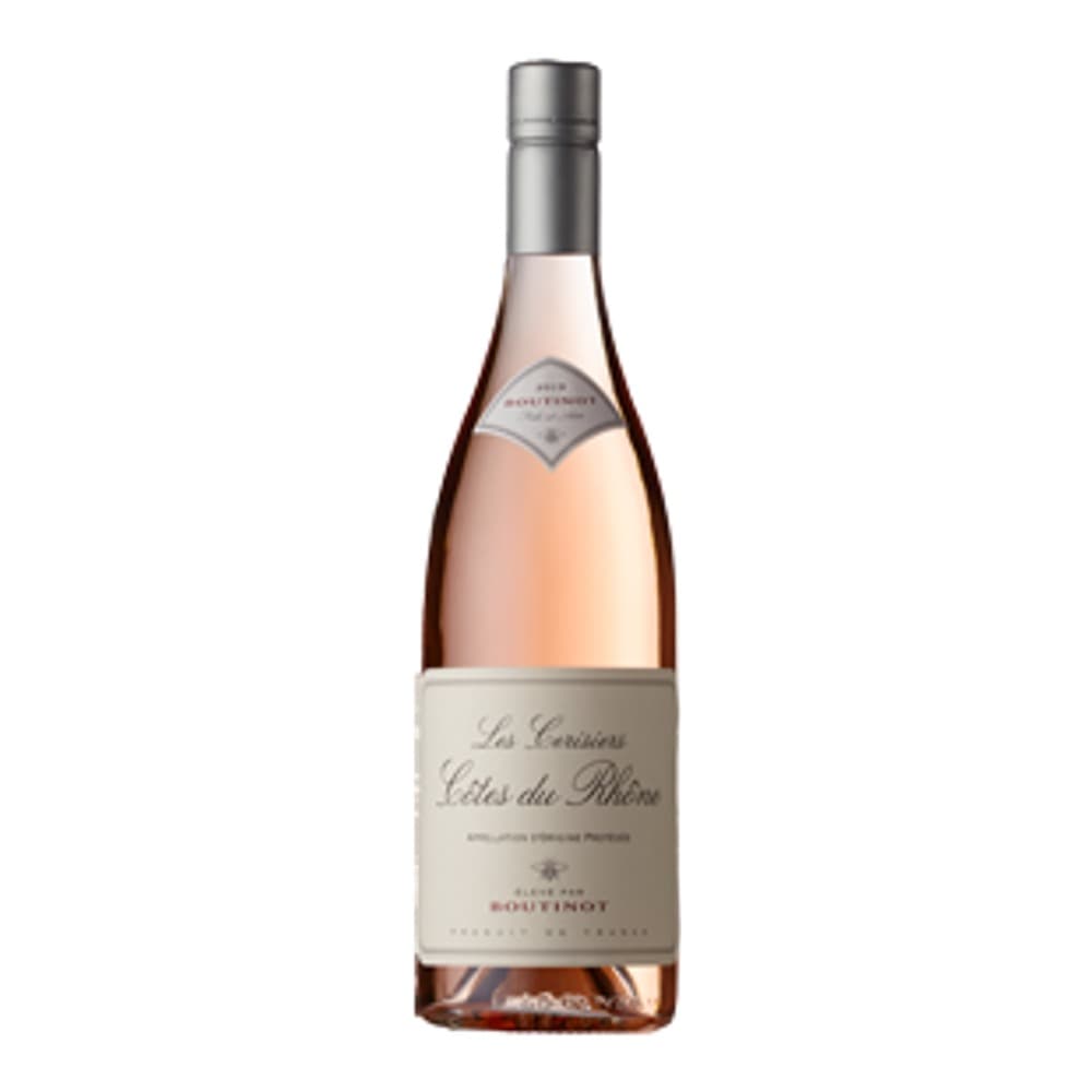 A bottle of Château d'Esclans rosé wine with pale pink label on white background