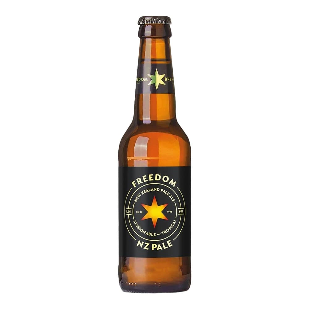 A glass bottle of Freedom New Zealand Pale Ale with a golden star logo and black label on a white background