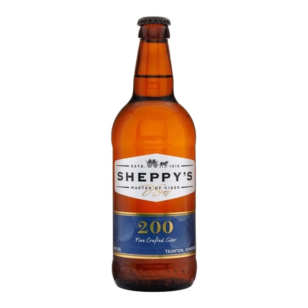 A bottle of Sheppy's 200 Fine Crafted Cider with amber glass, white and blue label, photographed against a plain white background.