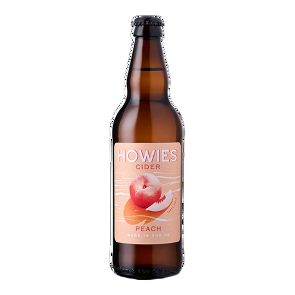 A brown glass bottle of Howes Peach Cider against a white background, featuring a peach-coloured label with an image of a fresh peach.