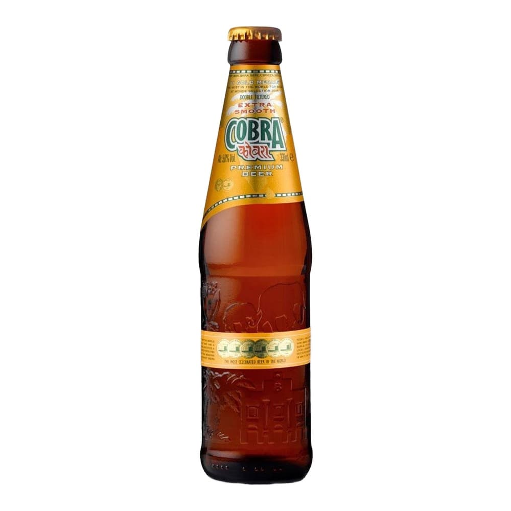 A Cobra Premium Beer bottle with golden label and amber liquid displayed against a white background