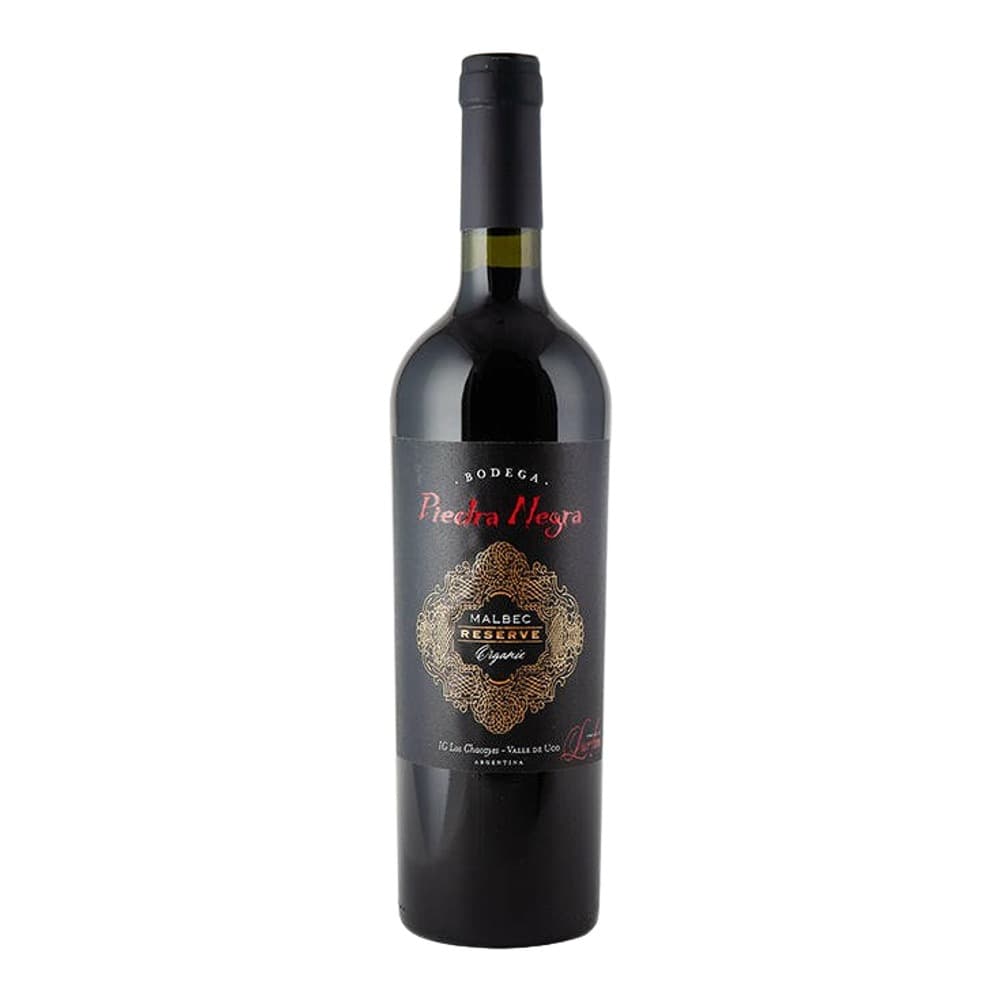 A bottle of Piedra Negra Malbec Reserve Especial red wine against a white background, featuring a dark label with gold ornamental design.
