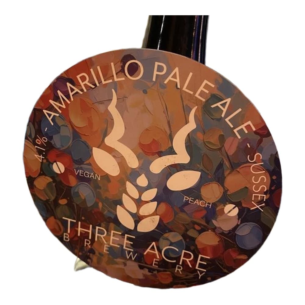 A bottle of Three Acre Brewery Amarillo Pale Ale with peach flavour displayed on a bar counter with bottles visible in the background