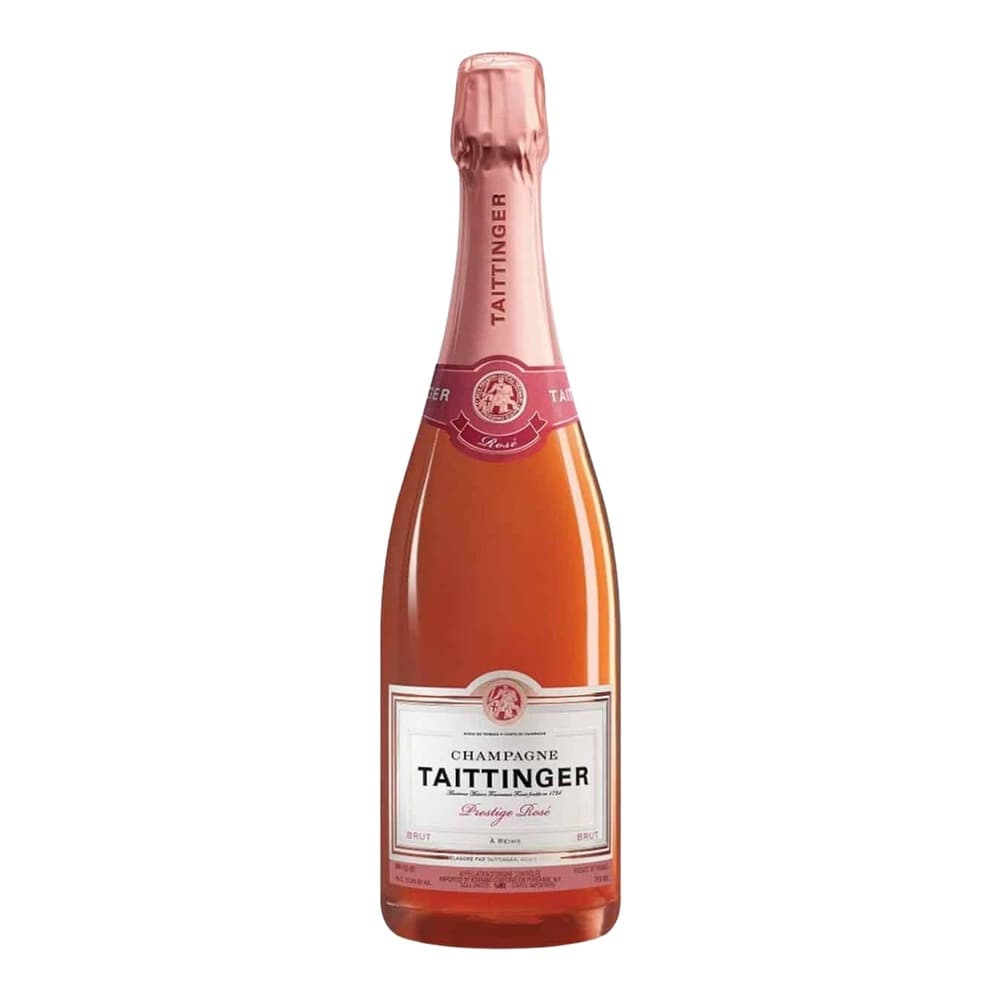 A bottle of Taittinger Prestige Rosé Champagne with pink foil, positioned against a plain white background.