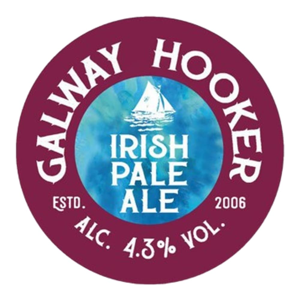 Circular burgundy beer label for Galway Hooker Irish Pale Ale, featuring a blue central circle with a white sailing boat illustration and white text displaying the brand name, alcohol content, and establishment year.
