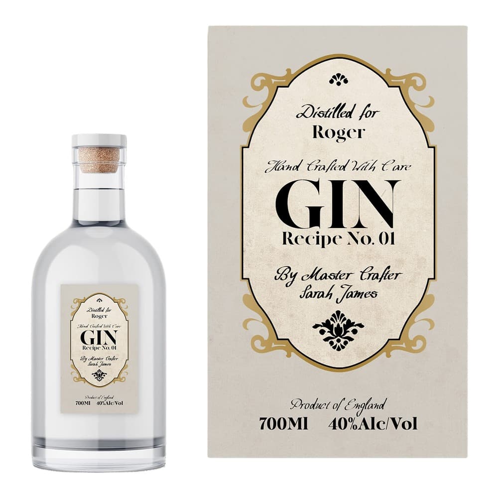 A clear glass bottle of gin with a cork stopper next to its decorative label featuring ornate gold borders and black typography.