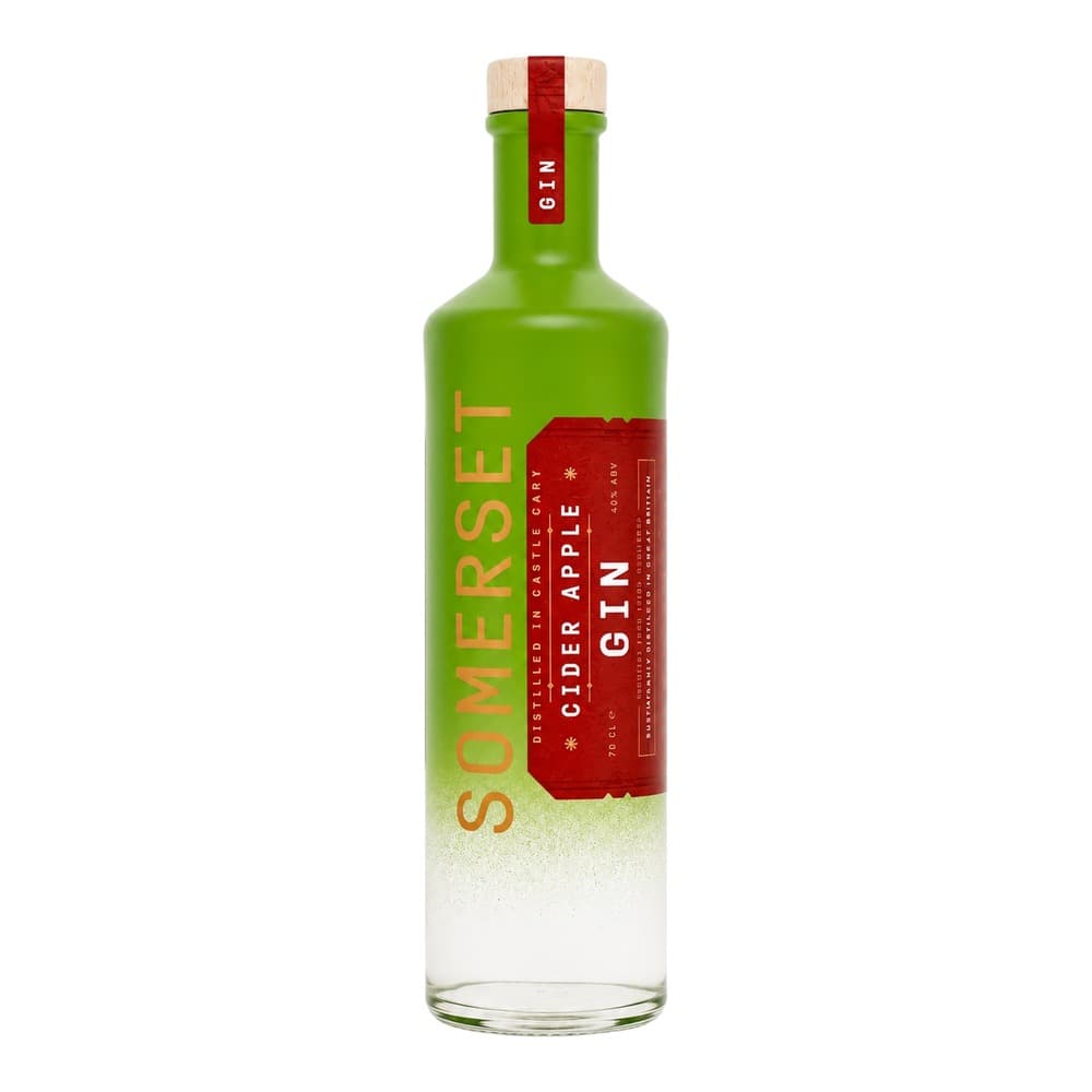 A green glass bottle of Somerset Cider Distilled in Cask Cider Apple on a white background, featuring a red and natural wood stopper and red label.