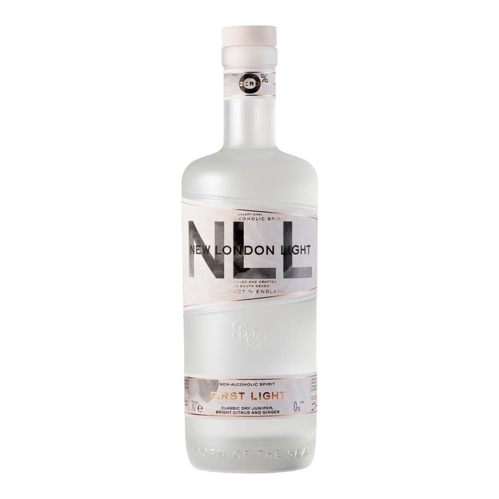 A clear glass bottle of New London Light non-alcoholic spirit with a white label featuring black and rose gold text, isolated on a white background.