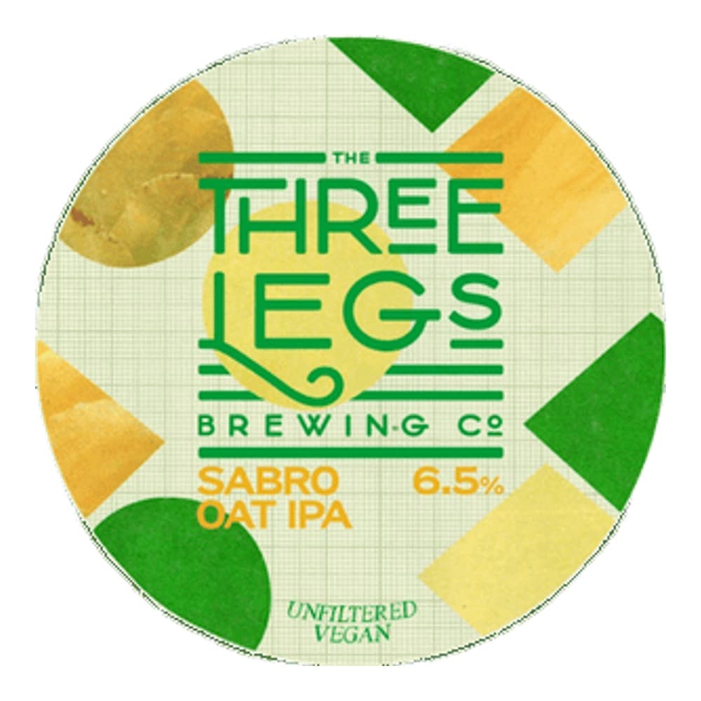 Circular beer label for Three Legs Brewing Co's Sabro Oat IPA, featuring green and yellow geometric leaf designs on a cream background, with text indicating 6.5% ABV, unfiltered and vegan.