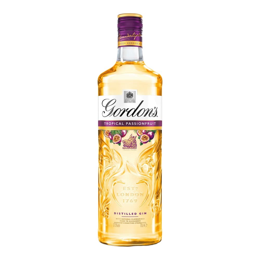 A bottle of Gordon's Tropical Passionfruit gin with purple cap and gold label on white background