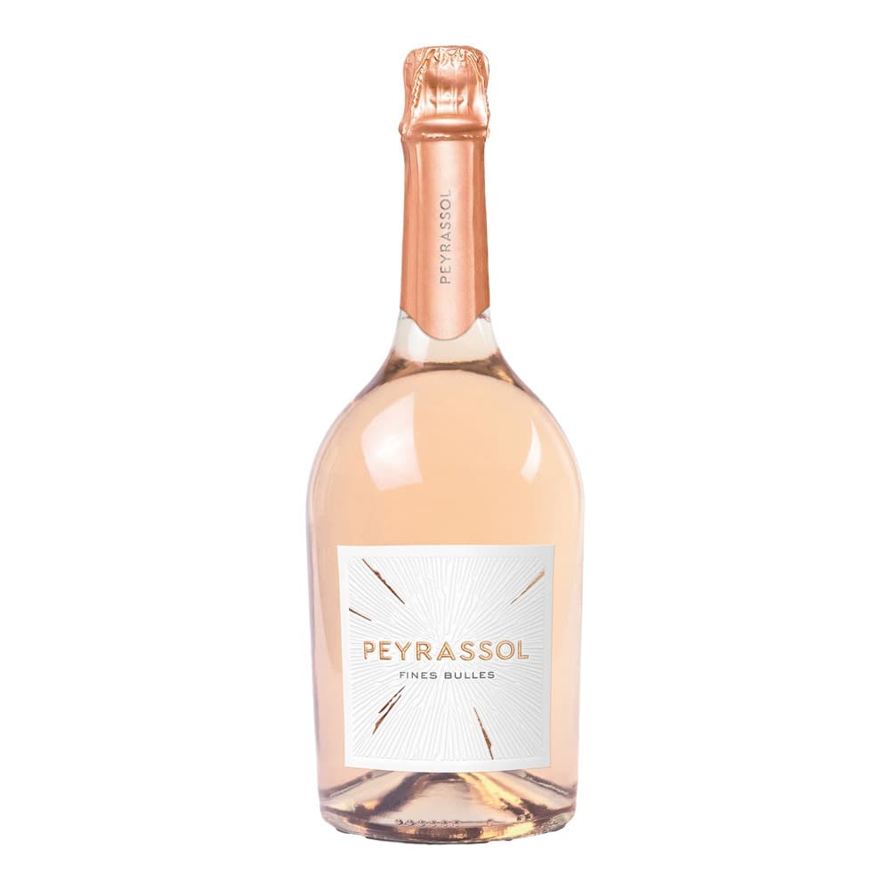 A bottle of Peyrassol Fines Bulles rosé sparkling wine with copper-coloured foil and white label, photographed against a white background.