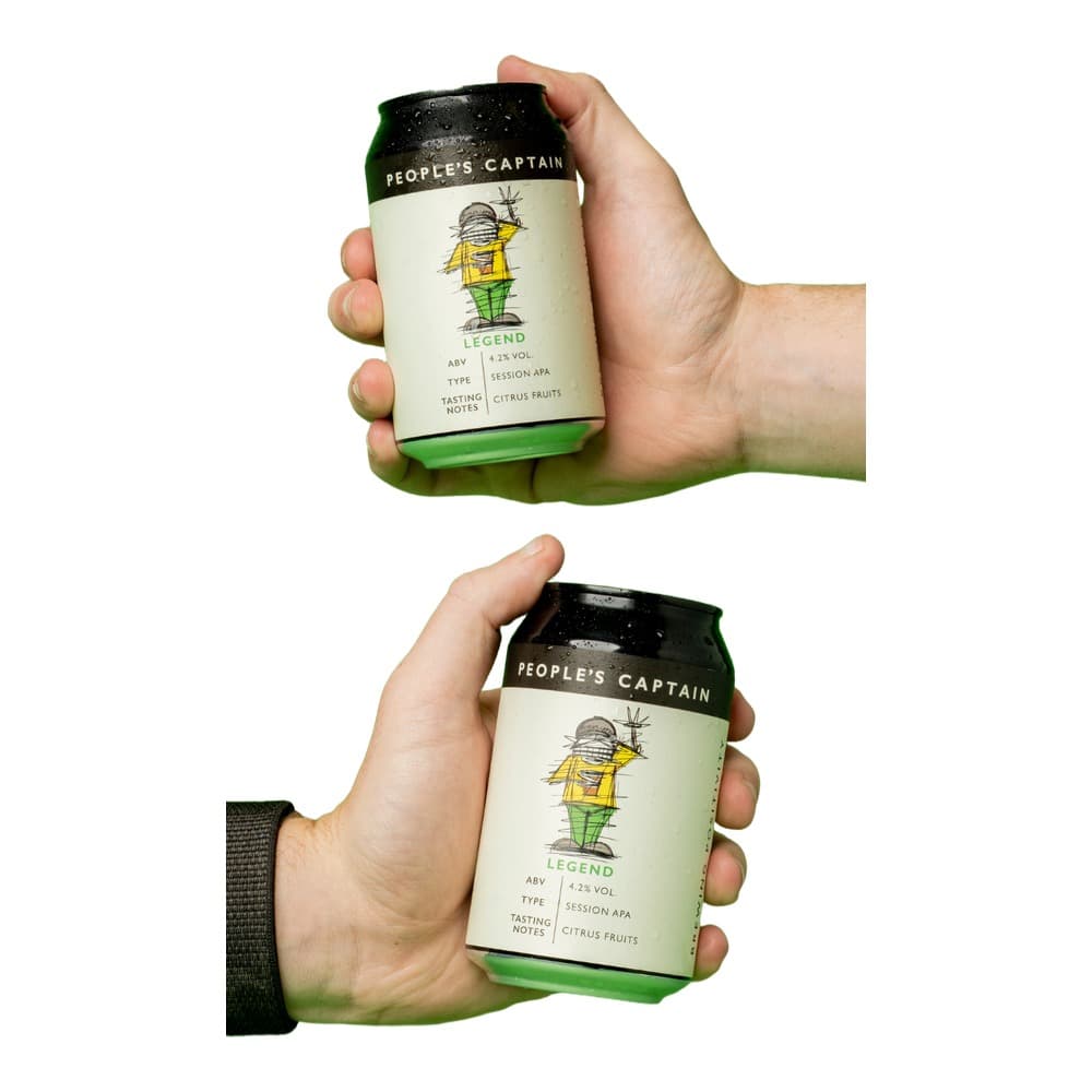 Two hands holding People's Captain Legend Session IPA beer cans against a bright green background
