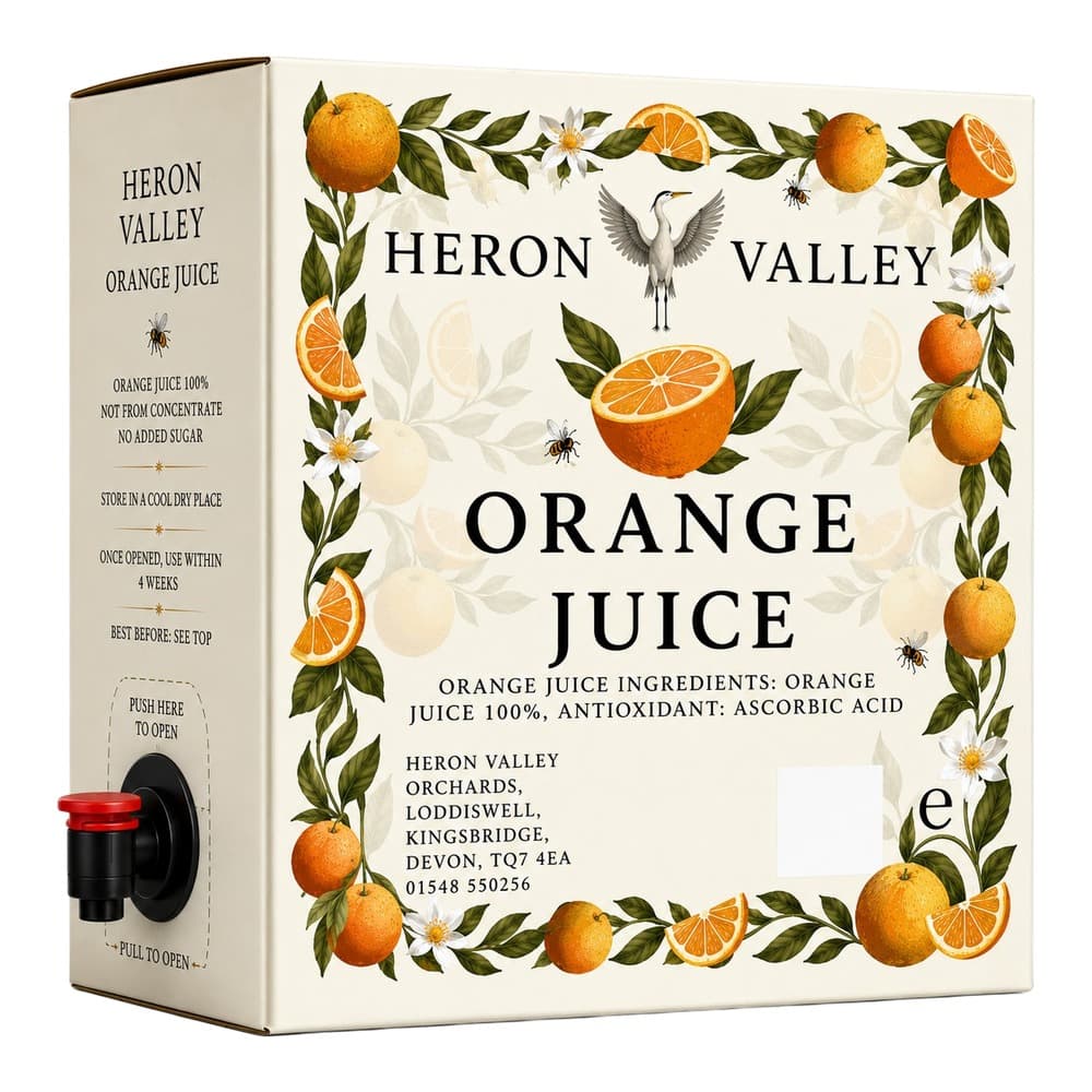 A cream-coloured carton of Heron Valley Orange Juice 100% with a black and red tap dispenser, decorated with illustrated oranges, green leaves, white flowers, and a grey heron.