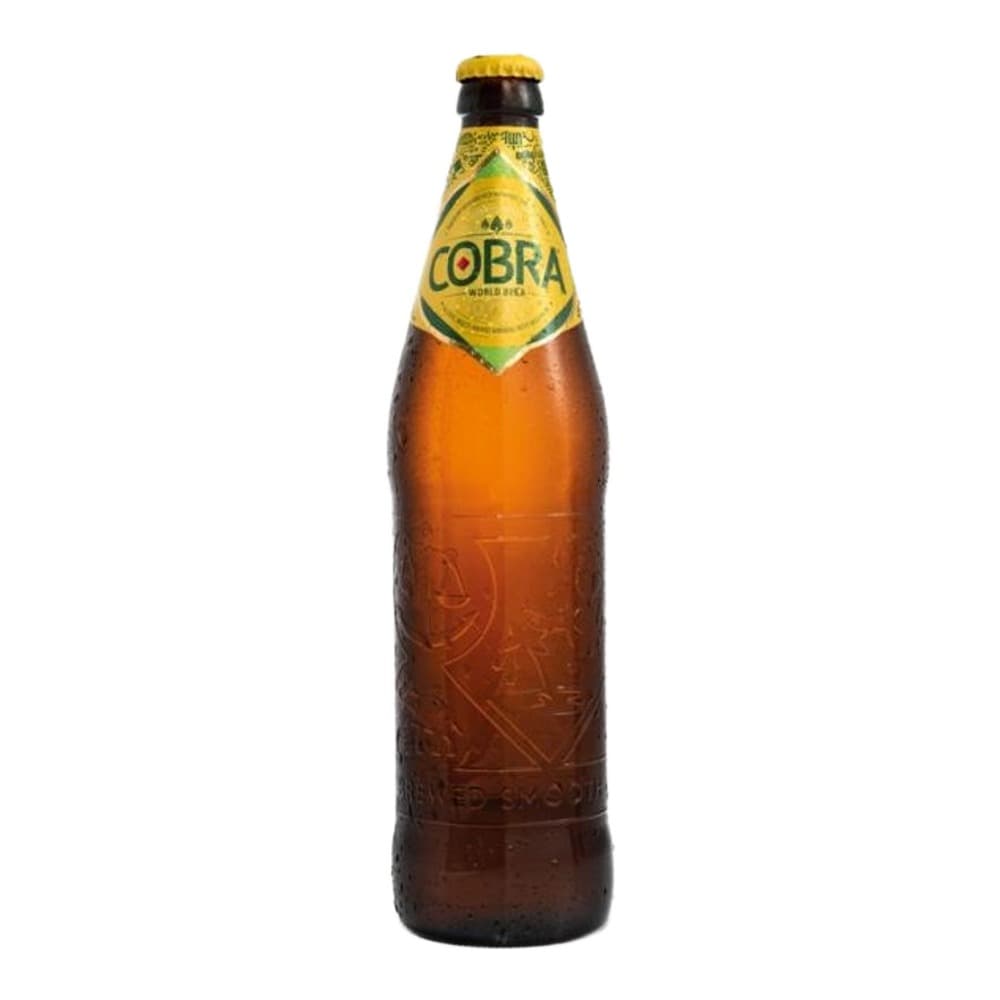 A Cobra brand beer bottle with a golden yellow cap and brown glass body, featuring a yellow label with red and green accents, isolated on a white background.