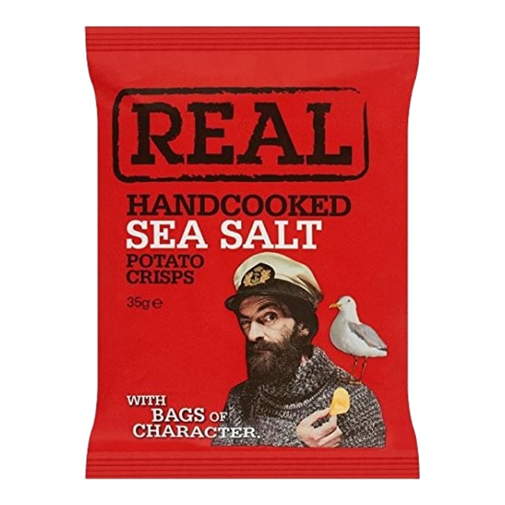 A red packet of REAL brand handcooked sea salt potato crisps featuring a bearded man in a sailor's hat holding a seagull and a crisp