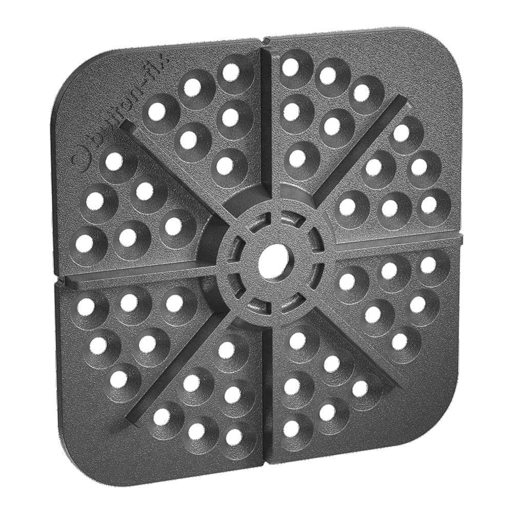 Square black metal waffle maker plate with circular indentations and central rotating mechanism, photographed on white background