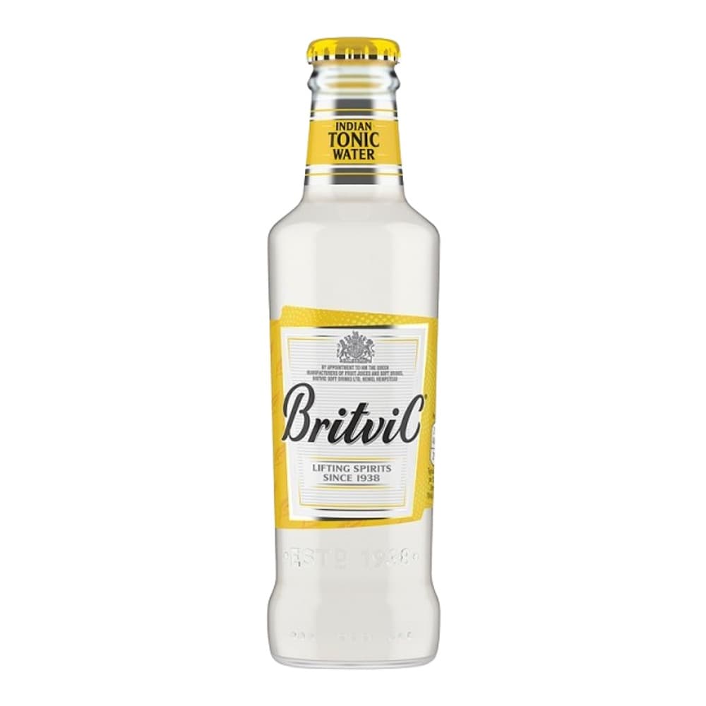 Clear glass bottle of Britvic Indian Tonic Water with yellow cap and yellow label on white background