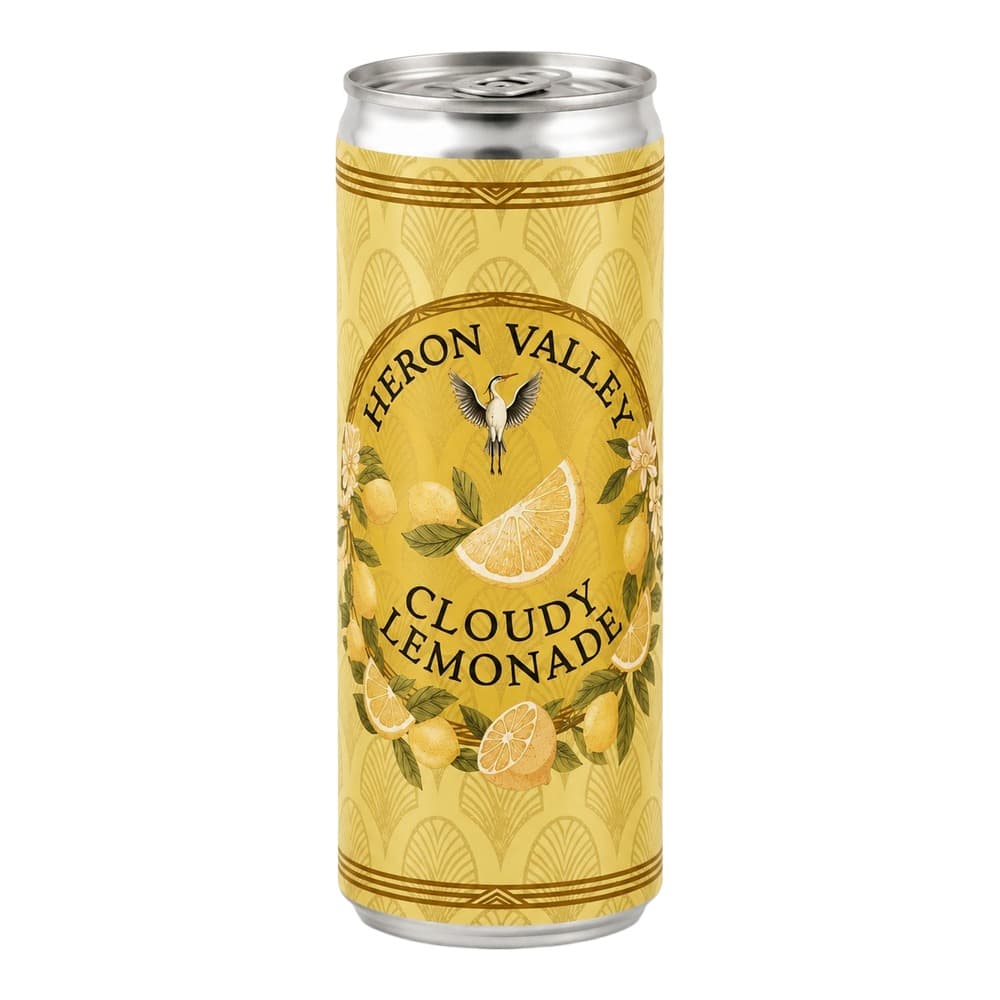 A tall aluminium can of Heron Valley Cloudy Lemonade with a yellow label featuring lemon illustrations and a heron logo, isolated on a white background.